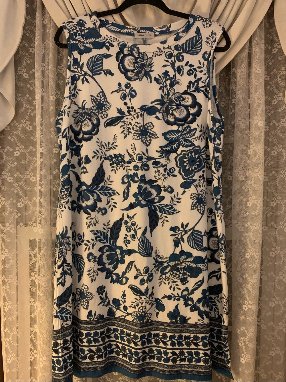 Sleeveless White Mini Dress with Blue Floral Print